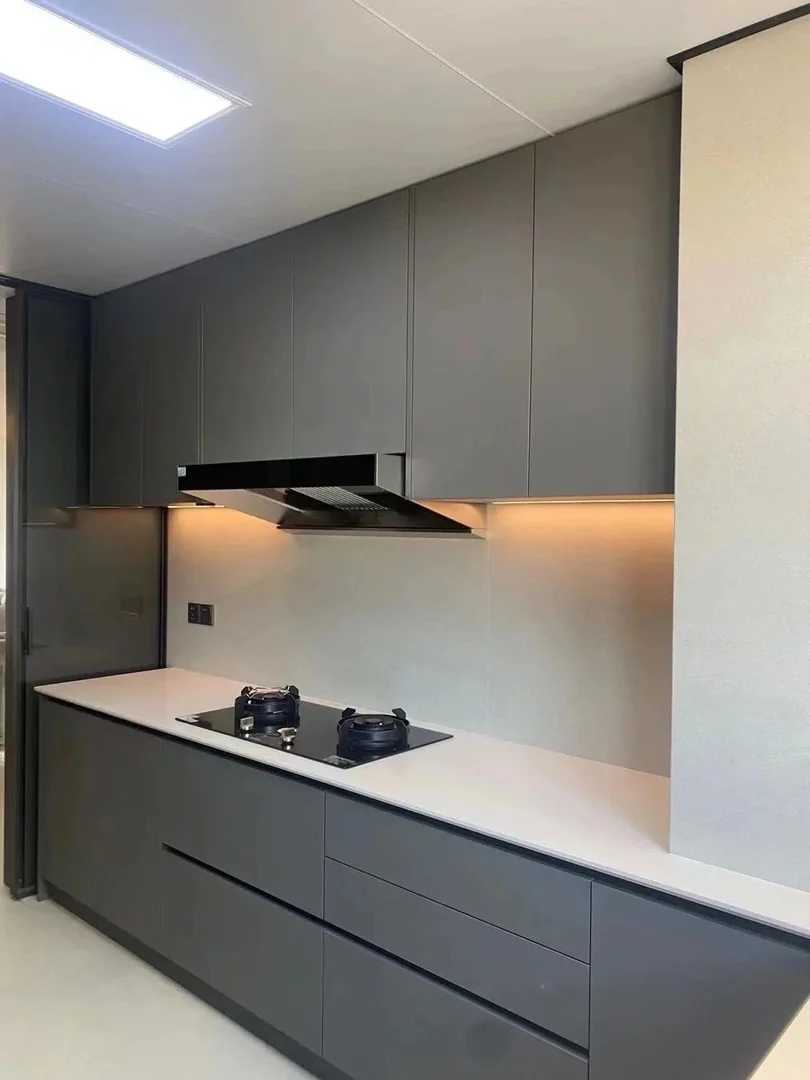 Grey kitchen cabinet with under-cabinet lighting for a Singapore home